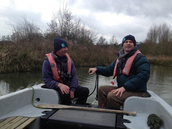 Simon Wotton watches Mike Dilger take the boat for a spin around Wetlands Discovery.