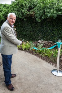 John Verdon cuts the ribbon to officially open the garden
