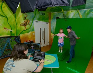 Child and staff using green screen by Bob Ellis