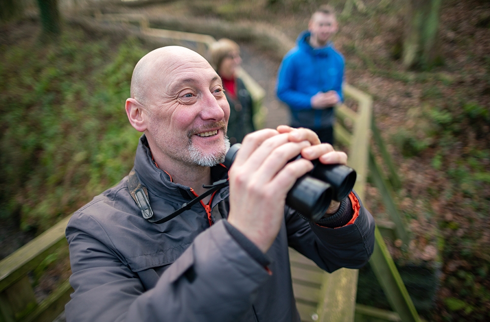 John Gowland at WWT Washington using his binoculars